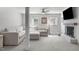 Bright living room features a painted brick fireplace and plush, neutral-toned sectional sofa at 4109 Huckleberry Dr, Raleigh, NC 27612