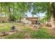 Expansive backyard with a deck, gazebo and a partially fenced yard perfect for outdoor entertaining at 412 Madison Ave, Cary, NC 27513