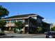 Charming commercial building with brick facade, expansive windows, and street-side seating at 412 Madison Ave, Cary, NC 27513