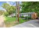 Charming home with inviting curb appeal, featuring a well-manicured lawn and lush landscaping at 412 Madison Ave, Cary, NC 27513