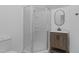 Bathroom featuring corner shower, wood vanity, and oval mirror at 413 Redpath Dr, Garner, NC 27529