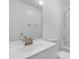 Clean bathroom featuring a shower and white vanity with gold faucet at 413 Redpath Dr, Garner, NC 27529