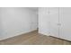 Bedroom with neutral walls, closet and wood-look floors at 413 Redpath Dr, Garner, NC 27529
