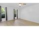 Bedroom with neutral walls, two windows, and wood-look floors at 413 Redpath Dr, Garner, NC 27529