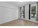 Bedroom featuring two windows and wood-look floors at 413 Redpath Dr, Garner, NC 27529