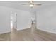Spacious bedroom with neutral walls, ceiling fan and wood-look floors at 413 Redpath Dr, Garner, NC 27529