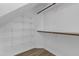 Walk-in closet with adjustable white wire shelving and wood floors at 413 Redpath Dr, Garner, NC 27529