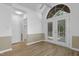 Sunlit dining area features French doors, arched window and a ceiling fan at 413 Redpath Dr, Garner, NC 27529