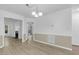 Bright dining room boasts neutral walls, chair rail detail and wood-look floors at 413 Redpath Dr, Garner, NC 27529