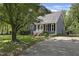 A well-maintained home with a driveway, manicured lawn, and inviting front porch at 413 Redpath Dr, Garner, NC 27529