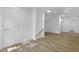 Open hallway with wood-look flooring and white walls at 413 Redpath Dr, Garner, NC 27529