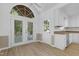 Kitchen and dining area with granite countertops and white cabinets at 413 Redpath Dr, Garner, NC 27529