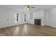 Bright living room featuring a fireplace, built-in shelves, and natural light from large windows at 413 Redpath Dr, Garner, NC 27529