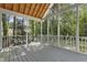 Relaxing screened porch with wood flooring, white rails and view of mature trees at 413 Redpath Dr, Garner, NC 27529