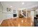 Spacious basement featuring a fireplace, hardwood floors, and a staircase leading to the upper level at 415 Forsyth St, Raleigh, NC 27609