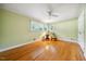 Bright bedroom featuring hardwood floors, neutral paint, and windows providing natural light at 415 Forsyth St, Raleigh, NC 27609