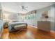 Relaxing bedroom with hardwood floors, bench seat, and plenty of light at 415 Forsyth St, Raleigh, NC 27609