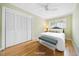 Bright bedroom featuring hardwood floors, double closet, and natural light at 415 Forsyth St, Raleigh, NC 27609
