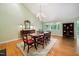 Dining room with hardwood floors, chandelier, and large windows at 415 Forsyth St, Raleigh, NC 27609