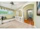 Sunny kitchen with a window bench, white trim, and arched doorway at 415 Forsyth St, Raleigh, NC 27609