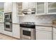 This kitchen has white cabinets, stainless steel appliances, and granite countertops at 415 Forsyth St, Raleigh, NC 27609
