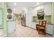 Spacious kitchen with white cabinets, stainless steel refrigerator, and tile flooring at 415 Forsyth St, Raleigh, NC 27609
