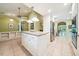 Open kitchen with tile floors, center island, and stainless steel appliances at 415 Forsyth St, Raleigh, NC 27609