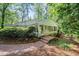 Back exterior featuring a sunroom with large windows, and brick stairs at 415 Forsyth St, Raleigh, NC 27609