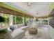 This sunroom has lots of windows, tile floors, and plenty of space to relax and dine at 415 Forsyth St, Raleigh, NC 27609