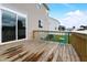 Spacious wooden back deck featuring light blue metal furniture and sliding glass doors at 4613 Jersey Pine Dr, Rolesville, NC 27571