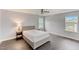 Cozy bedroom features a large bed, hardwood floors, and a ceiling fan at 4613 Jersey Pine Dr, Rolesville, NC 27571