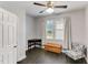 Neutral bedroom boasts ample natural light from the window with wood-look vinyl floors at 4613 Jersey Pine Dr, Rolesville, NC 27571