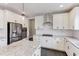 Modern kitchen with white cabinetry, stainless steel appliances, a central island, and granite countertops at 4613 Jersey Pine Dr, Rolesville, NC 27571