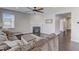 Comfortable living room with a fireplace, ceiling fan, and a stylish neutral color palette at 4613 Jersey Pine Dr, Rolesville, NC 27571