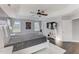 Bright main bedroom with a gray bedspread, large windows, and tray ceilings at 4613 Jersey Pine Dr, Rolesville, NC 27571