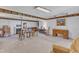 Finished basement featuring carpeted floors, wooden beams, and neutral colored walls at 4900 North Hills Dr, Raleigh, NC 27612