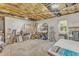 Unfinished basement area with exposed ceiling and concrete floors ready to be customized for storage and recreation at 4900 North Hills Dr, Raleigh, NC 27612