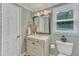Stylish bathroom with a decorative vanity and modern fixtures at 4900 North Hills Dr, Raleigh, NC 27612