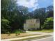 Two-story home with a rear entry garage and a well-maintained lawn and garden at 4900 North Hills Dr, Raleigh, NC 27612