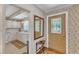 Foyer featuring a decorative front door that provides access to the kitchen and the living room at 4900 North Hills Dr, Raleigh, NC 27612