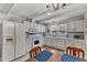 Functional kitchen with white cabinets, classic appliances, and ample countertop space at 4900 North Hills Dr, Raleigh, NC 27612