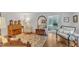 Spacious living room featuring hardwood floors, stylish furniture, and seamless flow into other living spaces at 4900 North Hills Dr, Raleigh, NC 27612