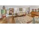 Living room with hardwood floors, traditional furnishings, and an adjacent dining area at 4900 North Hills Dr, Raleigh, NC 27612