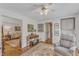 Cozy living room with hardwood floors, neutral paint and traditional furnishings at 4900 North Hills Dr, Raleigh, NC 27612