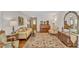 Comfortable living room showcasing elegant furnishings, including a sofa, piano, and area rug at 4900 North Hills Dr, Raleigh, NC 27612