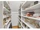 Spacious walk-in pantry with ample shelving for storage at 4900 North Hills Dr, Raleigh, NC 27612