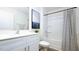Well-lit bathroom featuring a sleek vanity and a shower with a stylish curtain at 493 Lochalsh Dr, Gibsonville, NC 27249