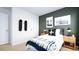 Tastefully decorated bedroom with a twin bed, dark accent wall, and trendy decor at 493 Lochalsh Dr, Gibsonville, NC 27249