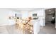 Open-concept kitchen with white cabinets, granite countertops, and stainless steel appliances at 493 Lochalsh Dr, Gibsonville, NC 27249