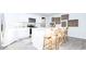 Bright kitchen features white cabinets, modern appliances, a kitchen island and stylish decor at 493 Lochalsh Dr, Gibsonville, NC 27249